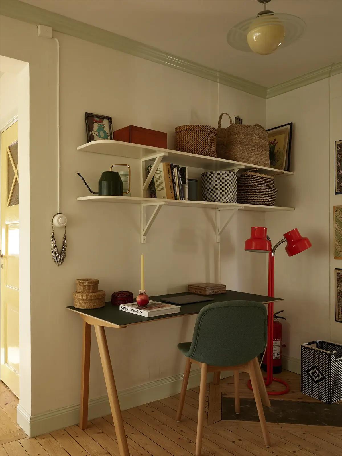 Workspace on the second floor with a red floor lamp