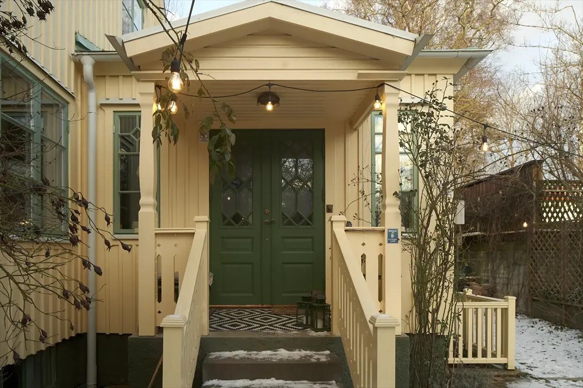 Entrance to the Swedish house with a green door