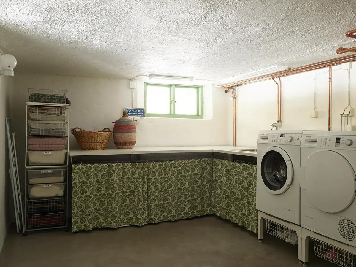 Basement laundry room with washing machine and dryer