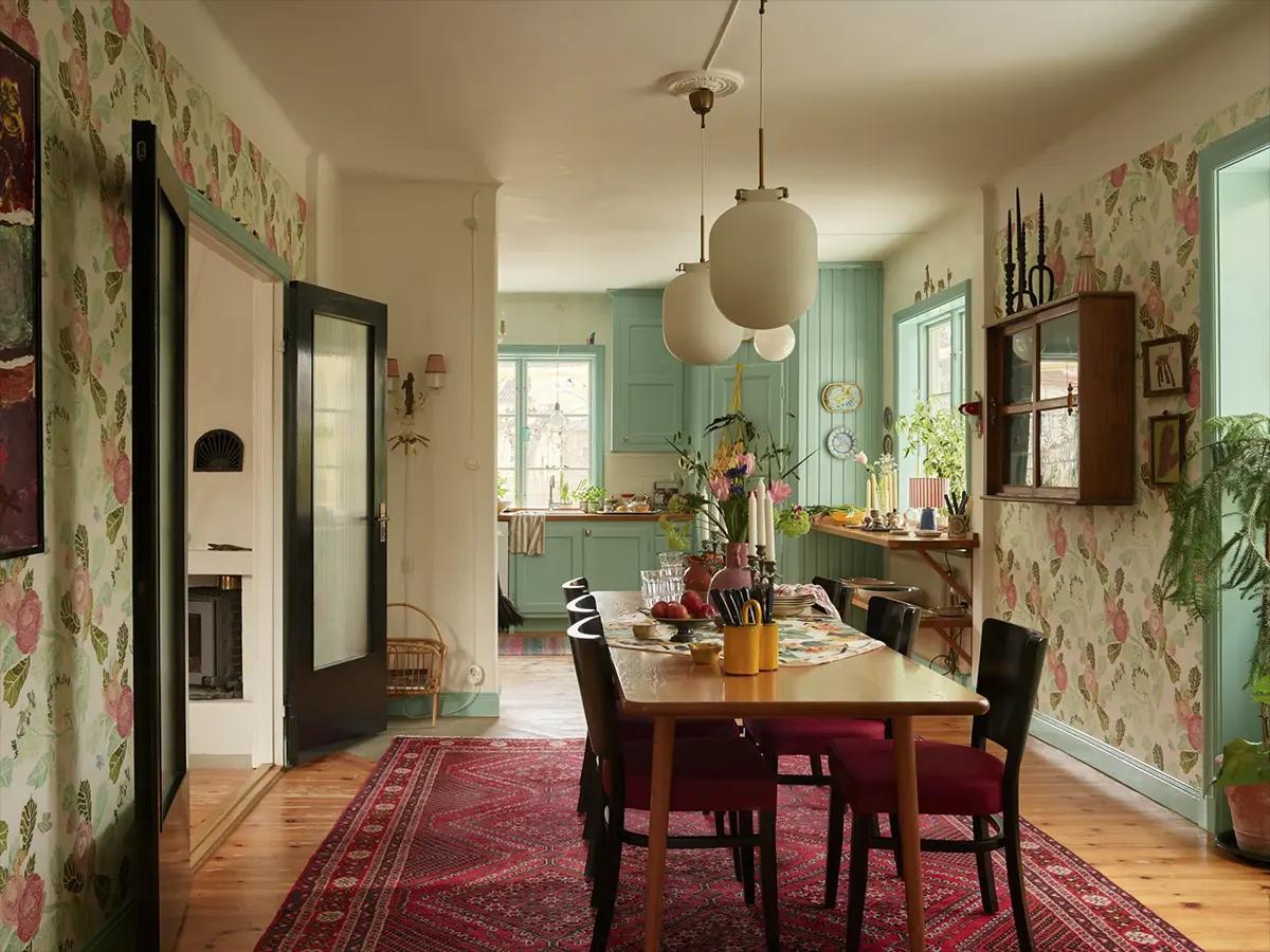 Dining area with a large table in the Swedish home