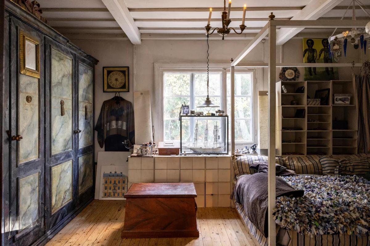 Atmospheric bedroom with canopy bed and hand-painted furniture