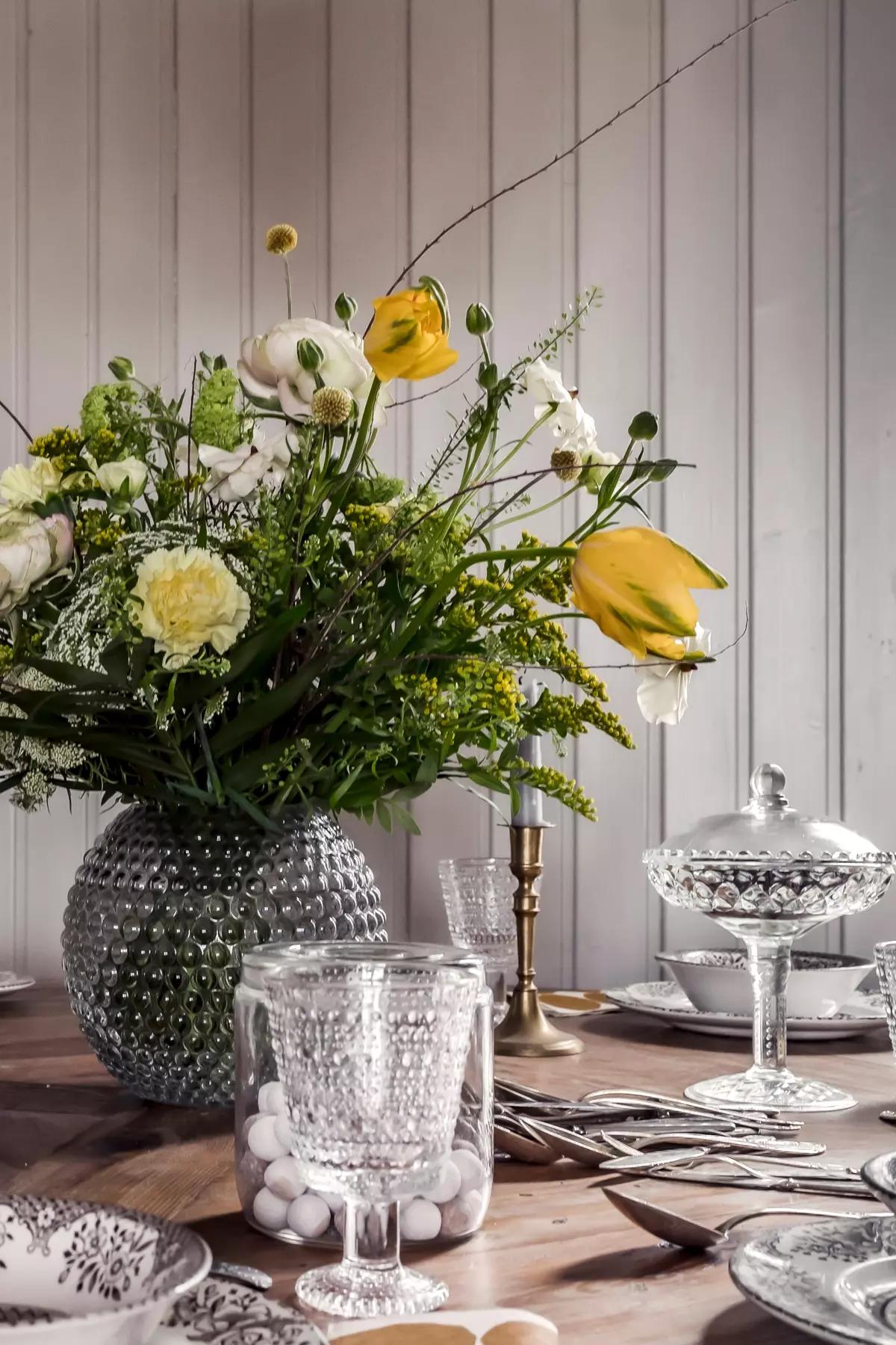 Flowers and glassware on the table