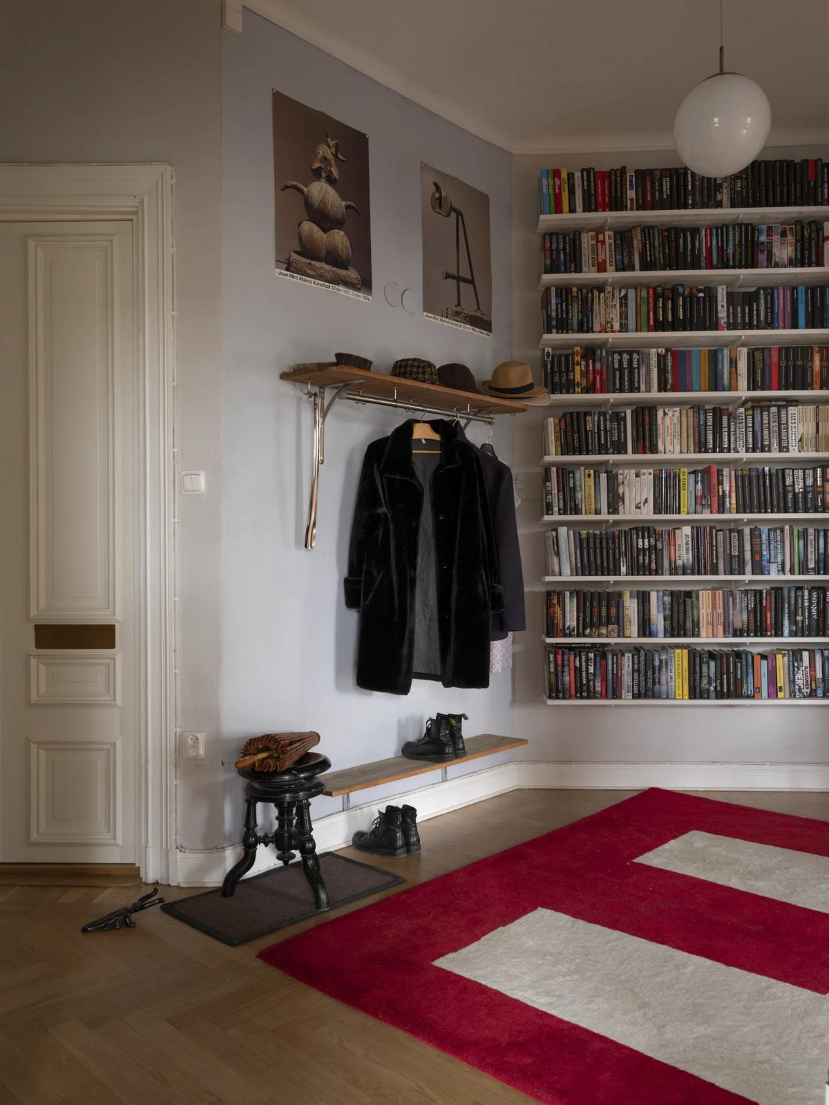 Built-in bookshelves in hallway of Swedish apartment