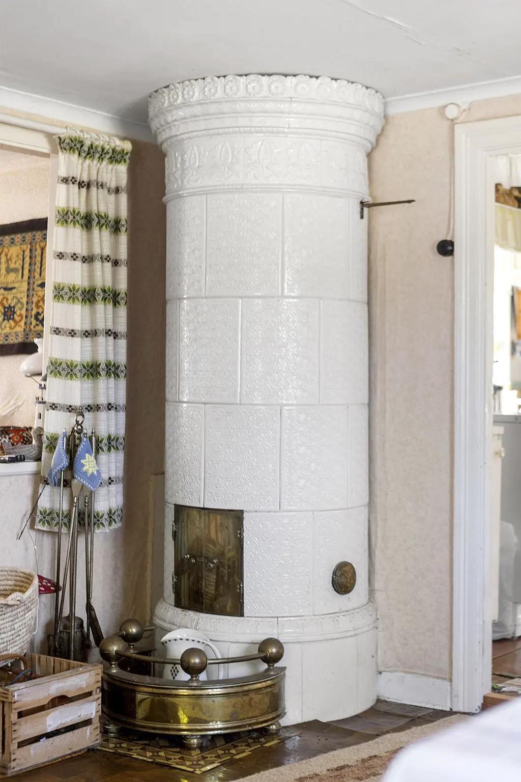 Traditional tiled stove in Scandinavian cottage