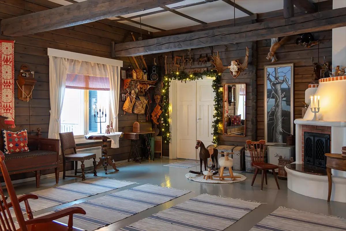 Holiday garland around a doorway in a wooden living room