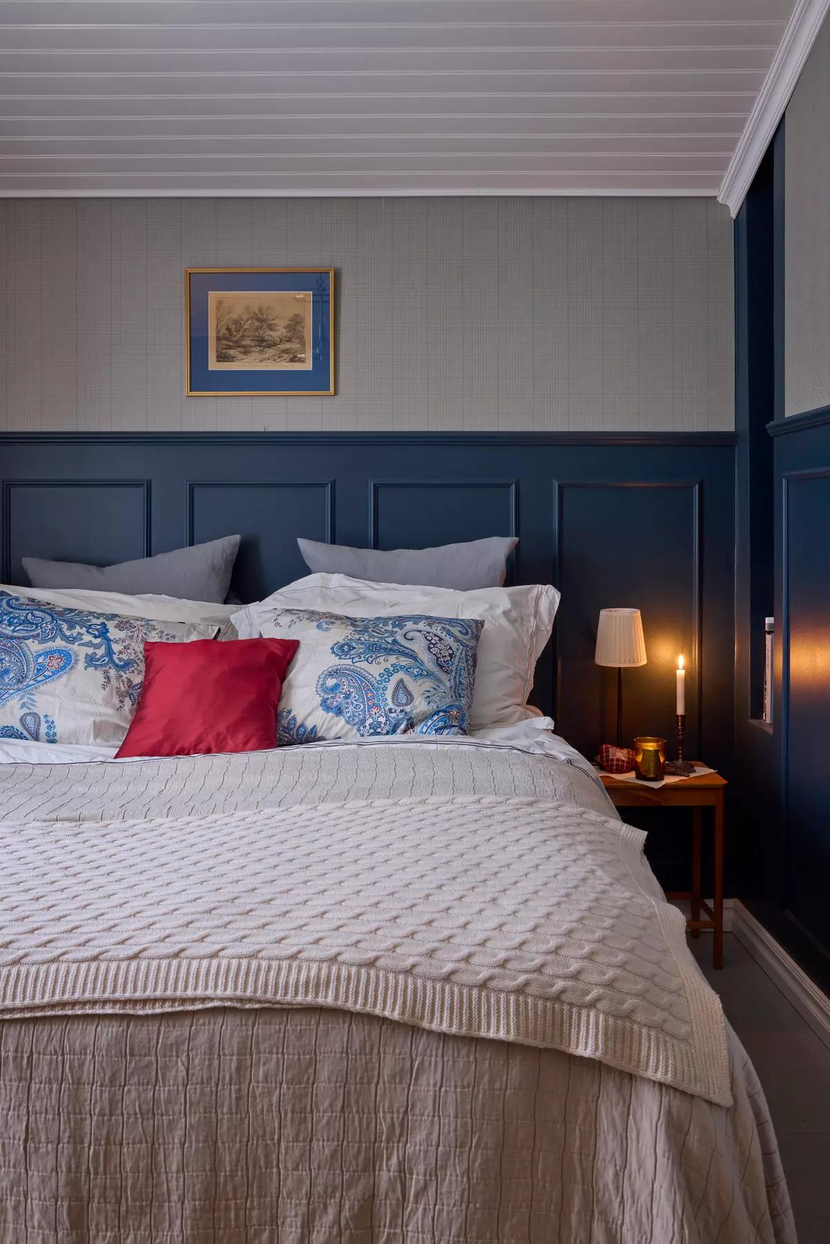 Simple Scandinavian bedroom with checked Ralph Lauren wallpaper and dark-blue Farrow & Ball panels