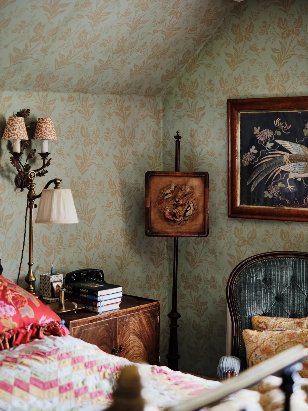 Bedroom nook furnished with antique wooden pieces