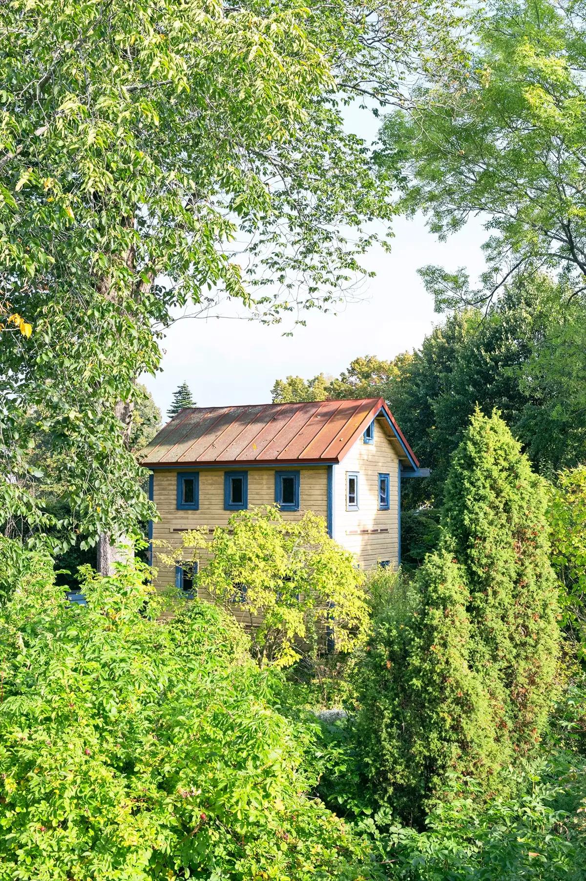 Bee pavilion surrounded by greenery
