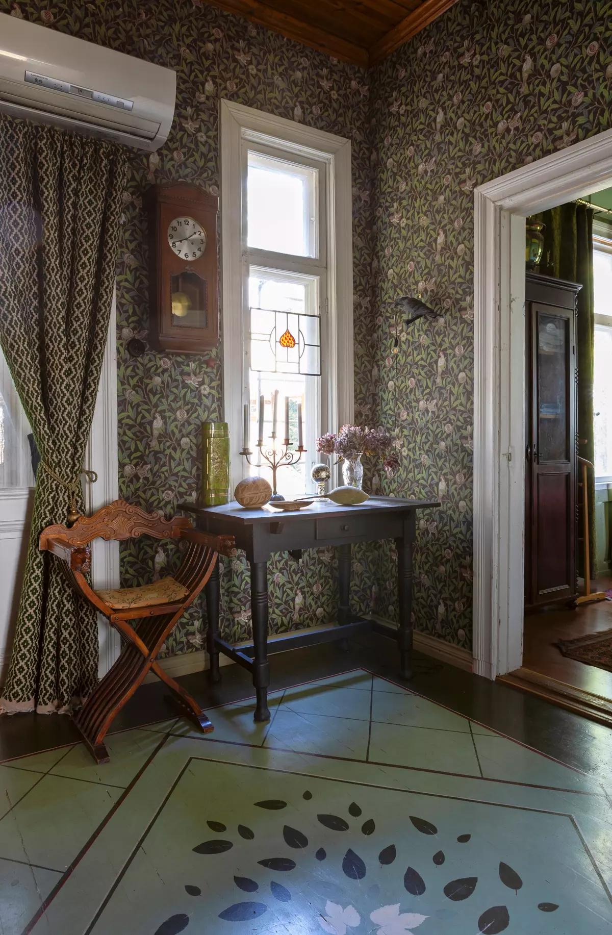 Entry hall in a Finnish house with a vintage table and chair