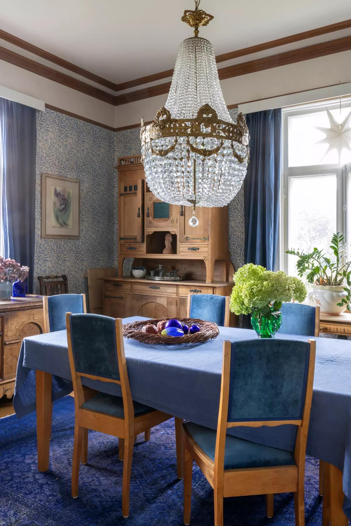 Large vintage chandelier above the dining table
