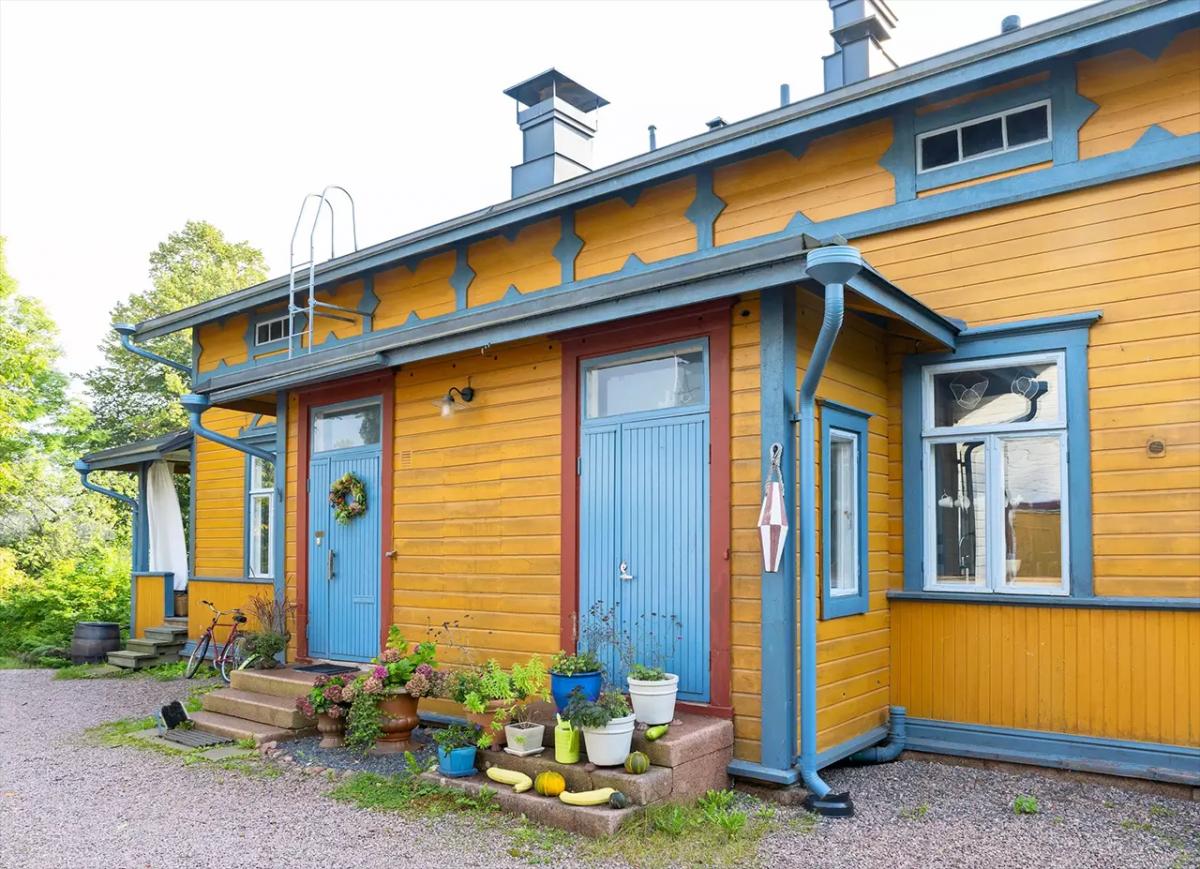 Yellow house with blue windows and doors